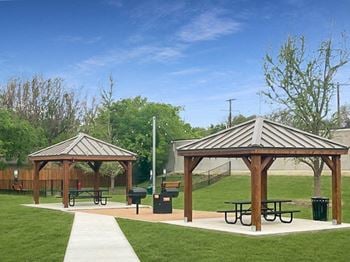 Courtyard w/ grills and outdoor seating area